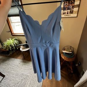 I am selling a light blue dress, it is shorter, about mid thigh length